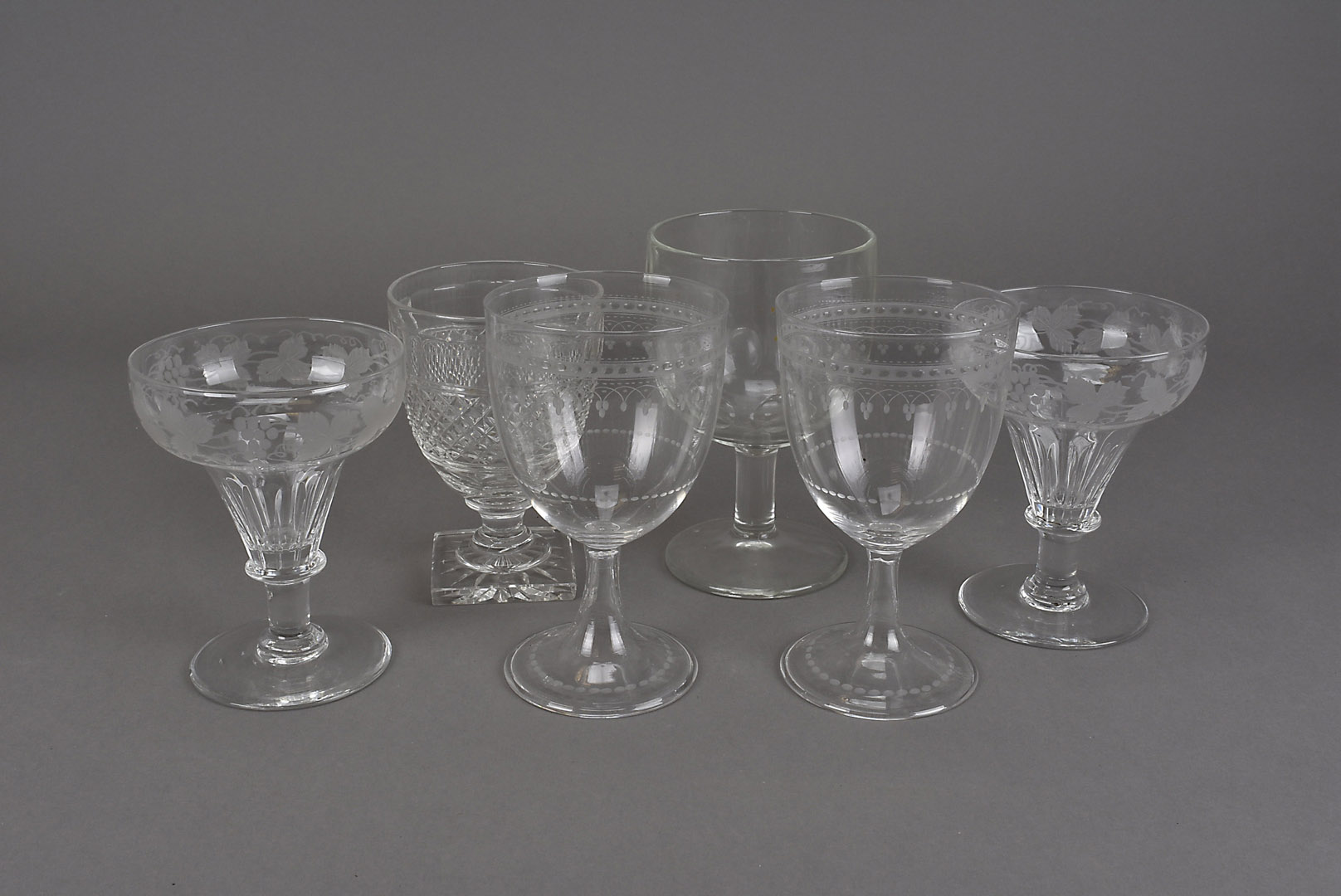 A collection of 19th Century rummers, including a pair with engraved grape and vine bowls, 13 cm