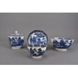 Four pieces of 19th century Caughley tea ware, including a tea bowl and saucer, lidded sucrier,