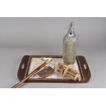 A butterfly wing tray, together with a wirework covered soda siphon, a pair of wooden bench