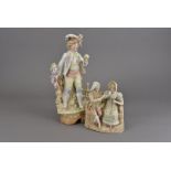 Two 19th Century Continental porcelain figures, one modelled as a young man with floral staff