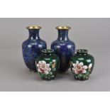 A pair of green cloisonné vases, the ovoid bodies with pink rose decoration having silver plated rim