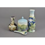 A modern Moorcroft small long neck vase, tube line decorated with open lilies to purple ground,