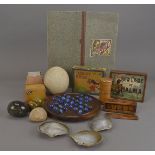 A miscellaneous collection of items, including board games, cedar card box, a large labradorite egg,