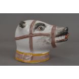 A 19th Century Staffordshire porcelain bear with muzzle stirrup cup, with polychrome decoration,