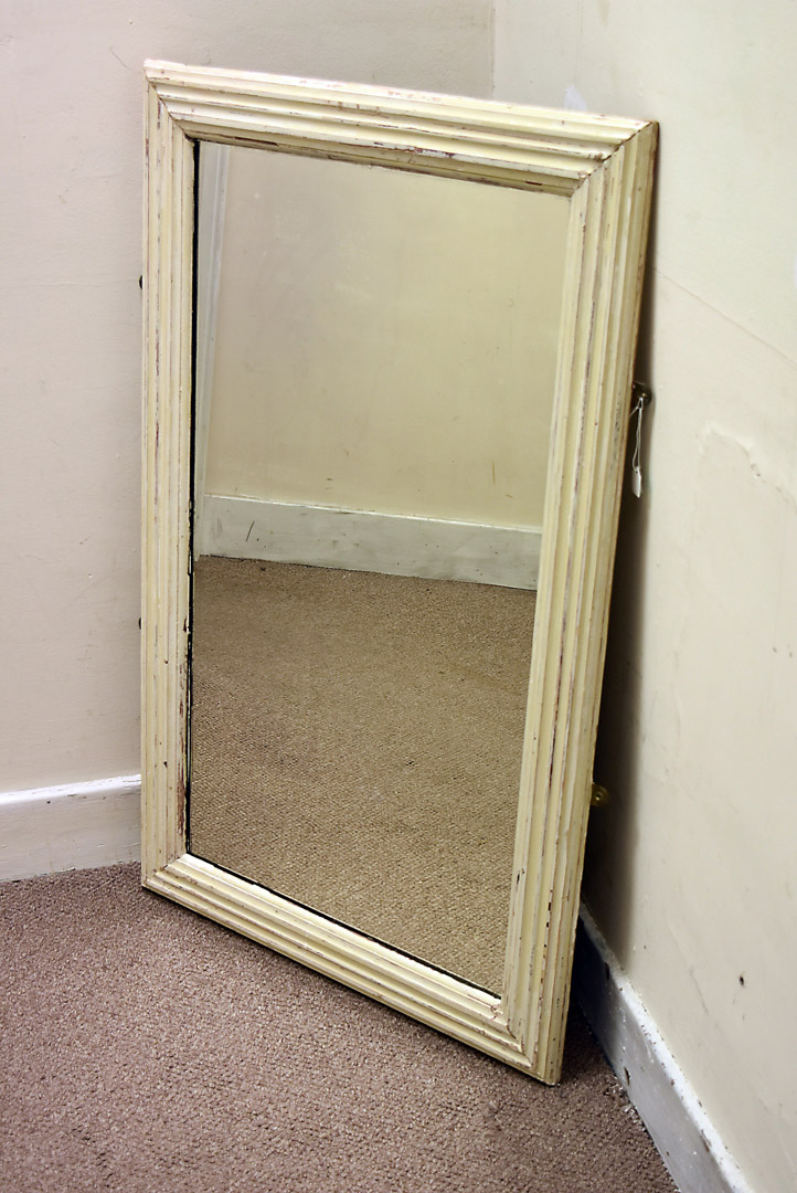 An Indian carved hardwood picture frame, with leaf and flower scroll decoration, 82 cm x 95 cm max