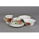 A 1970s Meakin Large Poppy pattern part dinner service, comprising six tea cups and saucers, six