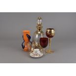 A continental art deco glass liquor set, the ovoid decanter having wheel engraved grape and vine