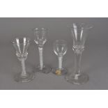 Three 18th Century cotton twist wine glasses, two with crimped bowls (one foot af) another with