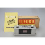 An Ilford Film Strip Printer, with half frame mask, in maker’s wooden box