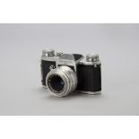 A Pentacon FM Camera, chrome, serial no. 126665, with a Primotar f3.5 50mm lens, serial no. 1923902,