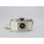 A Kodak Brownie 127 White Camera, with original grey neck cord, a special edition only sold in the