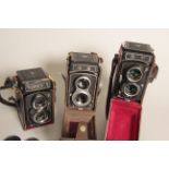 TLR Cameras, a Yashica 124G with two Seagull cameras, each in maker's case (3)