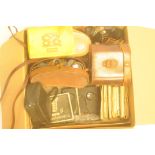 Three pairs of binoculars, cameras, opera glasses, stereo viewer and slides