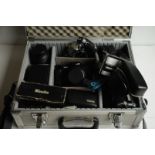 An Olympus OM 707 camera, Olympus OM 10 body and accessories, various lenses, power winder etc, in