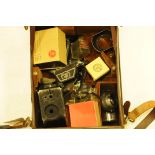 A collection of Bolex accessories, to include pistol grip, lens hoods, camera backs etc