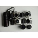 Four Pentax camera bodies, lenses in canvas carry bag