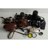 A collection of compact, vintage and SLR cameras, including Voigtlander Pronto LK, Miranda