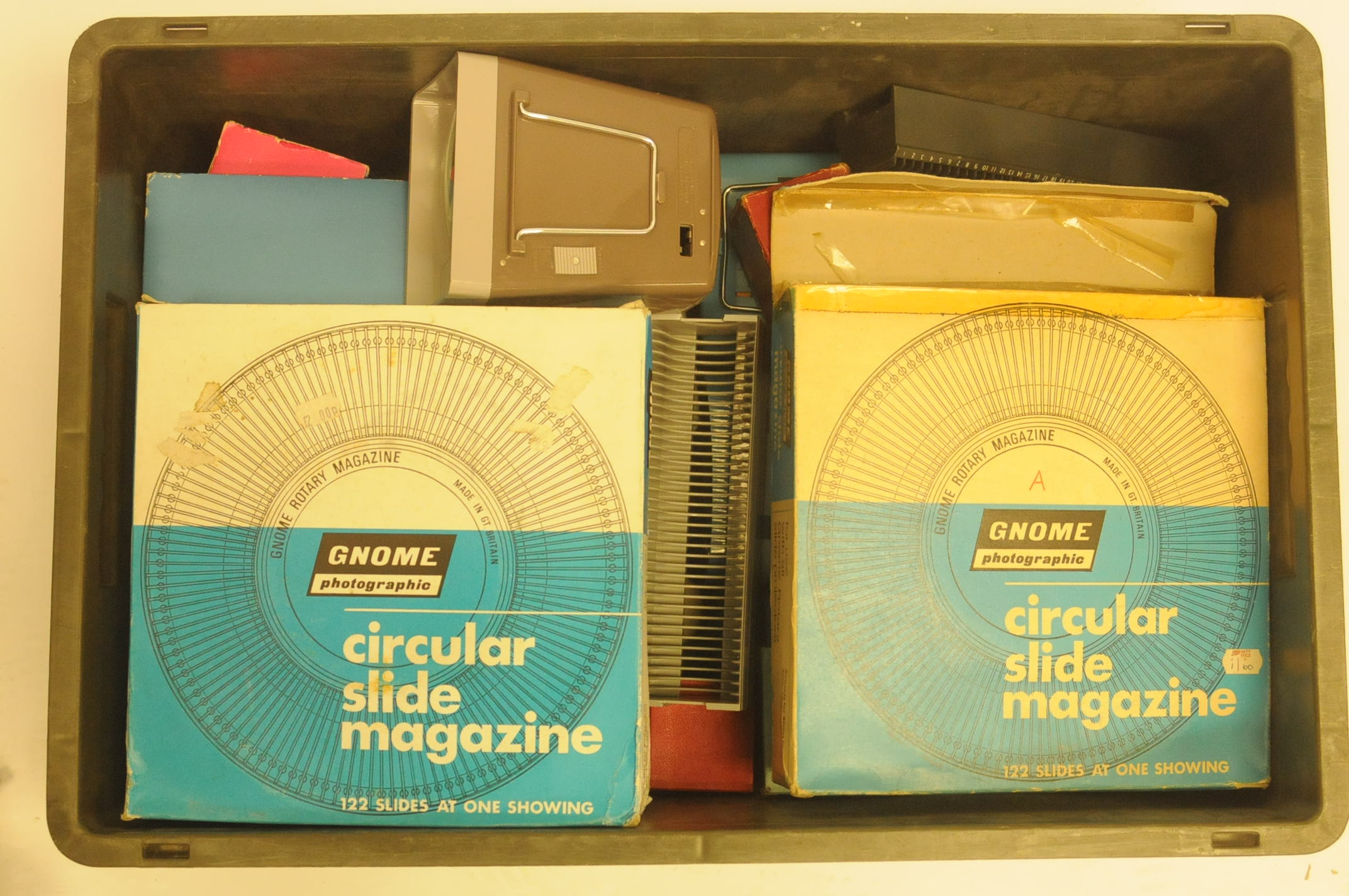 Two boxes of camera related books and literature, together with slide viewers and slide