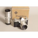 A Praktina FX Camera, in maker's box with an F2 58mm Biotar lens also an F4 135mm Triotar lens (a