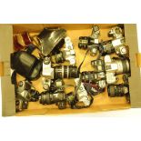 A collection of 35mm cameras, to include Minolta, Praktica, Canon and other examples