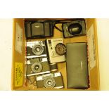 A collection of compact cameras, to include Minox 35GT, Olympus Pen, Canon Dial 35 etc