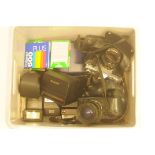 A collection of 35mm cameras, polaroid cameras, some flash units and polaroid film