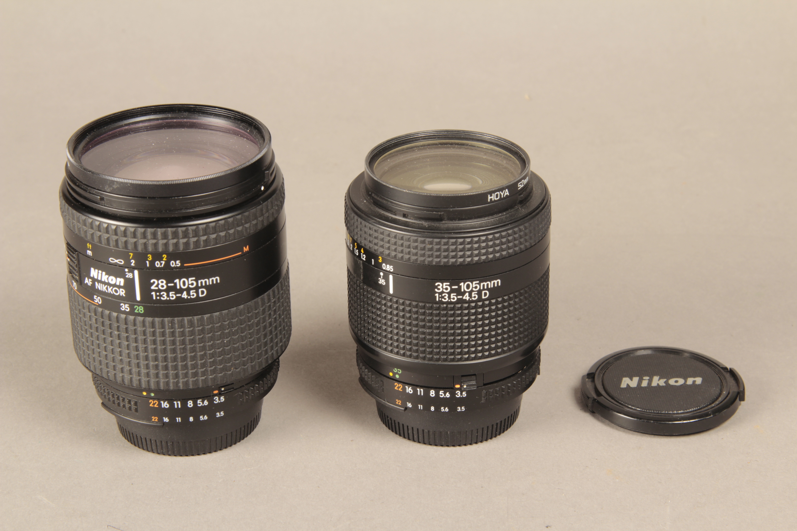 A Nikon AF 28-105 Lens, F3.5-4.5D model together with a 35-105 f 3.5-4.5 D Nikkor (2)