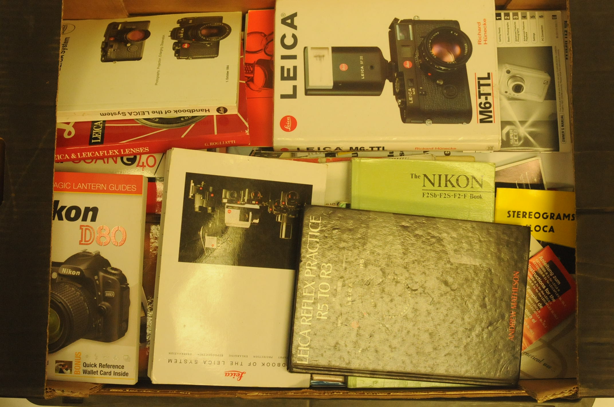 Two boxes of camera related books and literature, together with slide viewers and slide - Image 2 of 2