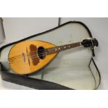 Mandolin, eight string in hard case flat back reasonable condition