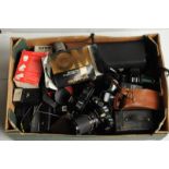 Various cameras and accessories, including Nikon, Olympus, cine cameras etc