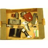 Camera accessories, including Bolex pistol grip, Carl Zeiss M58 polarising filter, Leica film copier