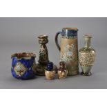 A collection of Royal Doulton secessionist pottery, including a table lamp base, jug, bowl, vase,