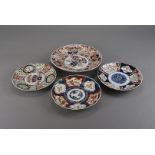 An oriental Imari pattern plate, decorated with red and blue floral design, approx 27cm diameter,