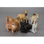 A collection of Beswick and Royal Doulton dogs, plus a Royal Doulton ginger tomcat (8)