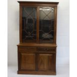 A Victorian mahogany elevated bookcase, the top with astral glazed doors with adjustable wooden