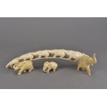 Three Japanese late Meiji period carved ivory okimonos, as elephants, together with a late 19th