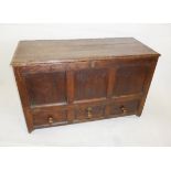 An 18th century and later oak mule chest, with peg and wire hinges, candle box, and three lower