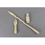 A bone carved coachman 6 cm H, together with a Napoleonic prisoner-of-war carved tool (possibly a
