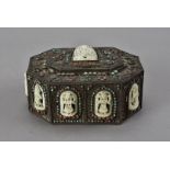 An Indian brass ashes box, the bone panels carved with deities including Shiva surrounded by semi-