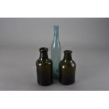 A pair of 18th century brown glass bottles, one with broader string rim, both with kick-up punts