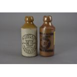 Two vintage stoneware ginger beer bottles, one by W. Lant & Co. of Coventry, the other Steward &