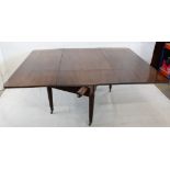 A William IV mahogany drop leaf dinning table, the swivel rectangular top with pull out supports
