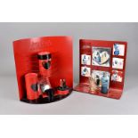 A Jean Paul Gaultier Red Med Valentine shop display, the curved red enamel back supporting a