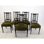 A set of four Edwardian mahogany single chairs, and a matching carver in the aesthetic taste, the