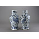 A pair of 19th century Chinese porcelain baluster vases, decorated in the transitional style with
