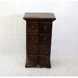 A modern hardwood double cabinet, fitted with eight square shaped drawers on bracket feet, 46 cm