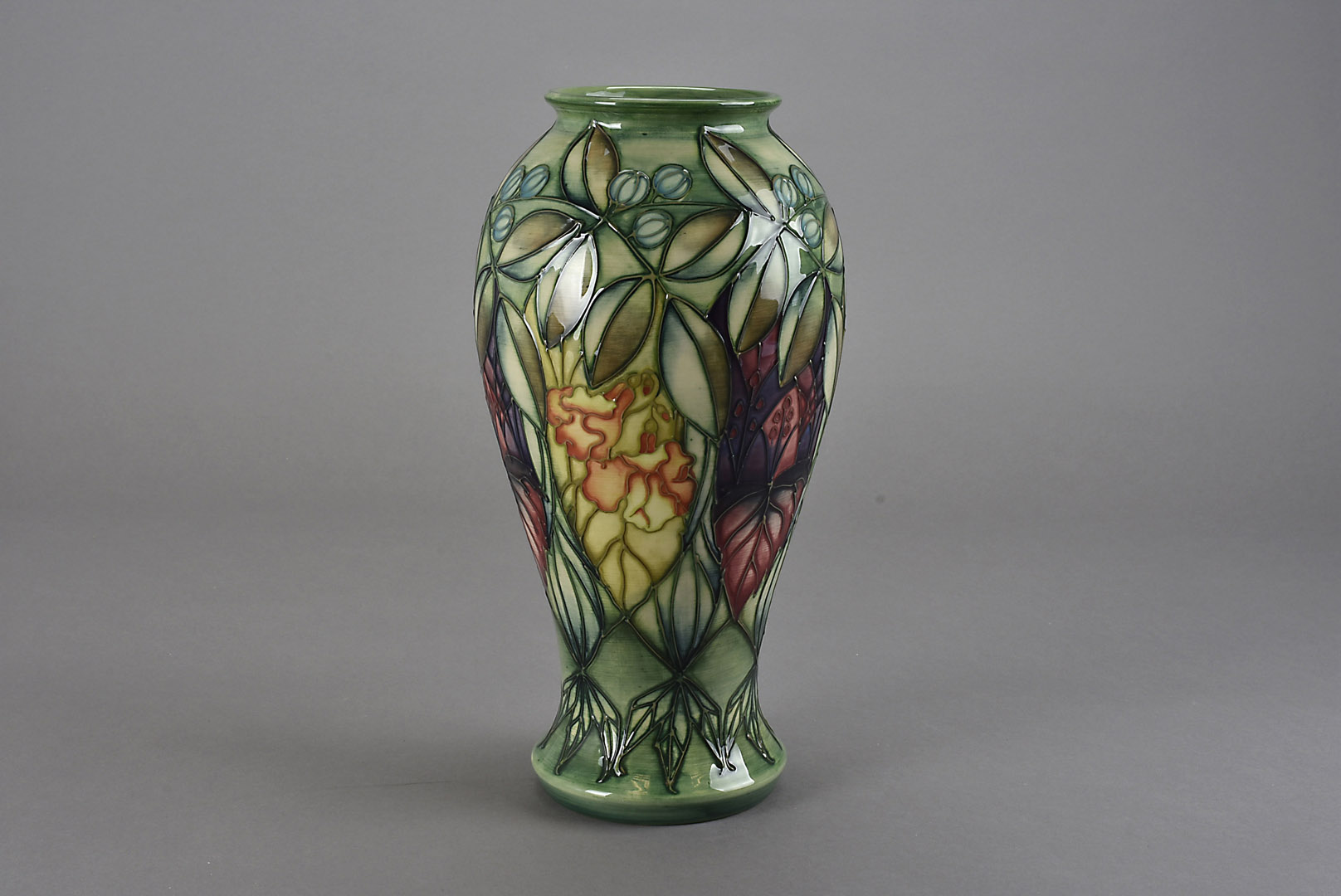 A Moorcroft Pottery vase, of baluster form in the Rainforest pattern by Sally Tuffin 1994, with
