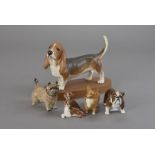 A Group of Beswick dogs, including a Basset Hound on plinth, Bulldog 'Bosun', Corgi, Cairn