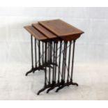An Edwardian nest of burr walnut and satin wood cross banded three tables, on turned legs with metal
