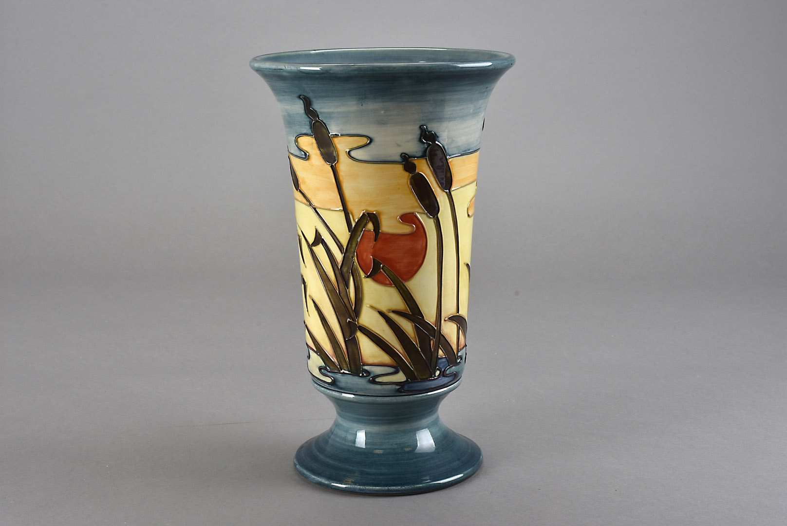 A Moorcroft Pottery vase, of footed trumpet form and decorated c. 1990 in the Reeds at Sunset